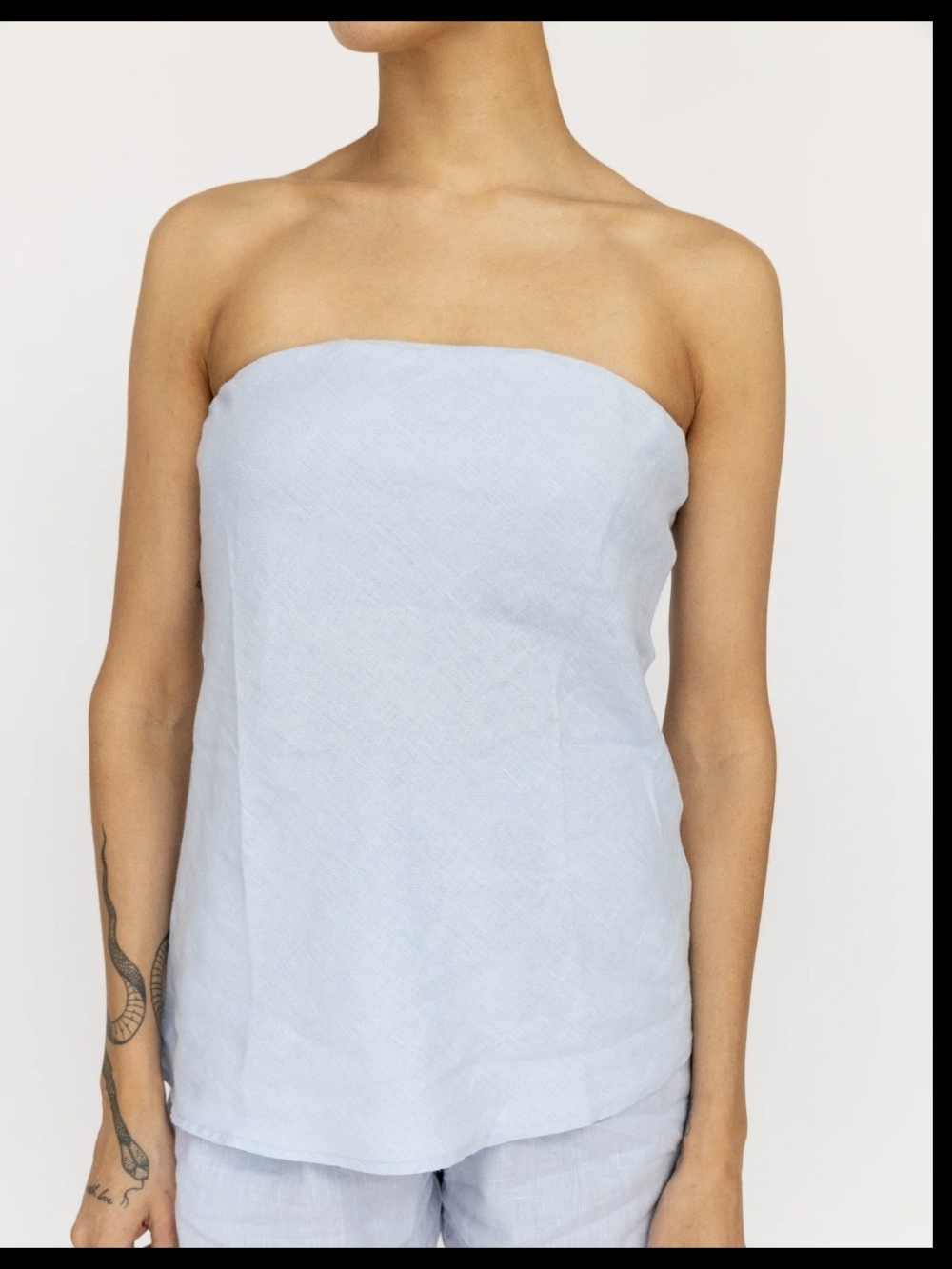 DONNI. Pastel Blue Strapless Linen Blend Top